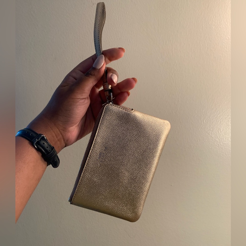 Metallic gold Coach wristlet